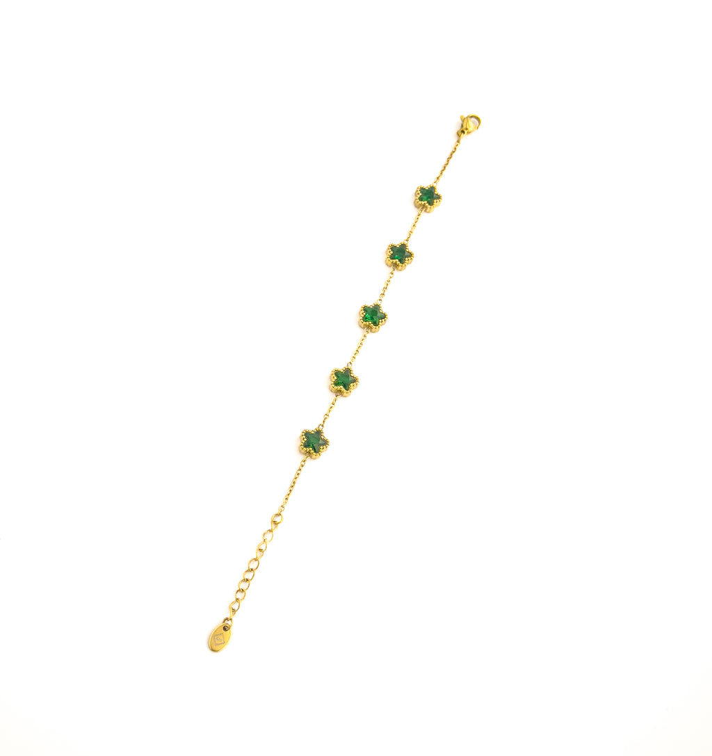 Gold bracelet with green clover gemstones