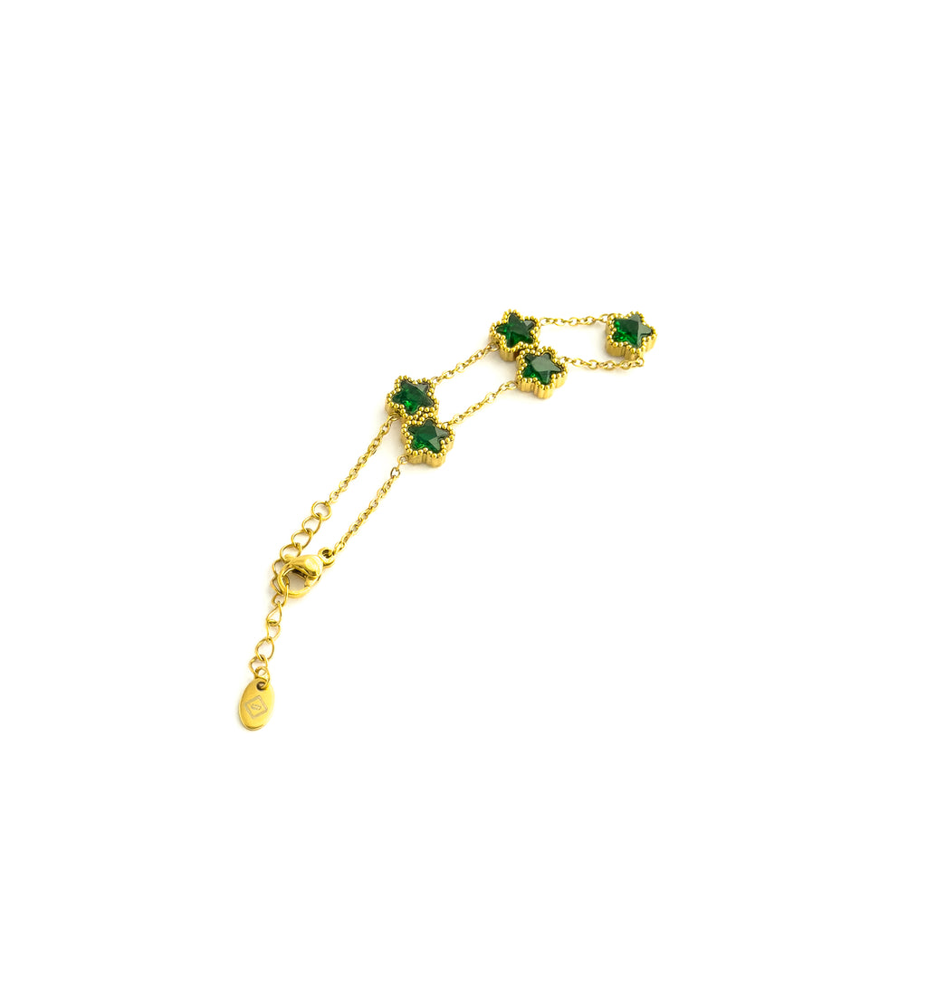 Gold bracelet with green clover gemstones